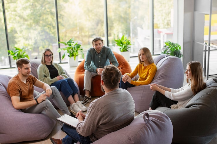 support group therapy session in Chicago where individuals share experiences and receive emotional support