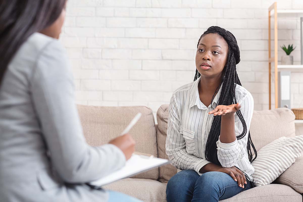 therapy session in Chicago discussing mental health support and affordable care options with a therapist