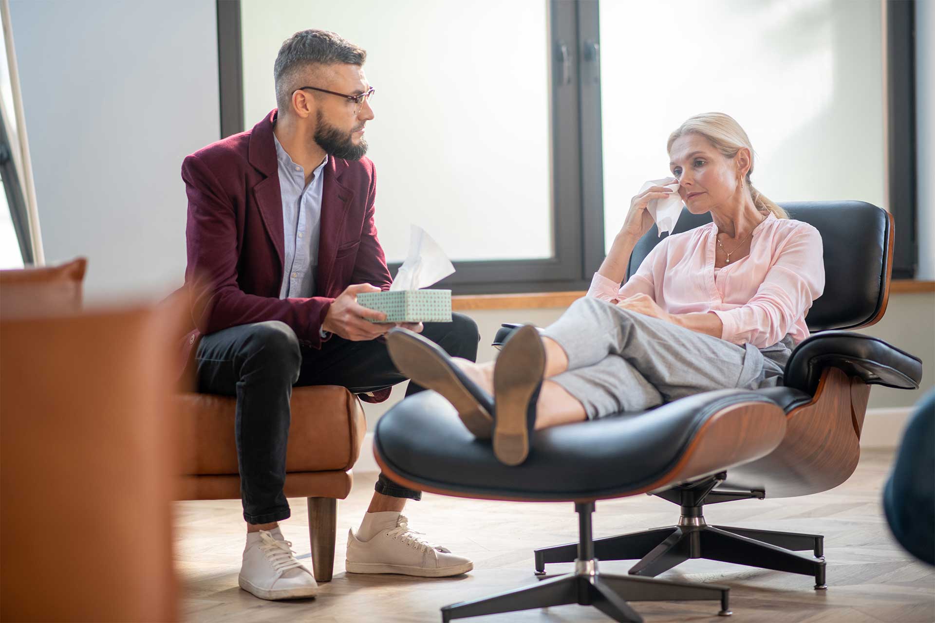 therapist working with client in a professional clinical setting in Chicago representing mental health careers and therapy practice